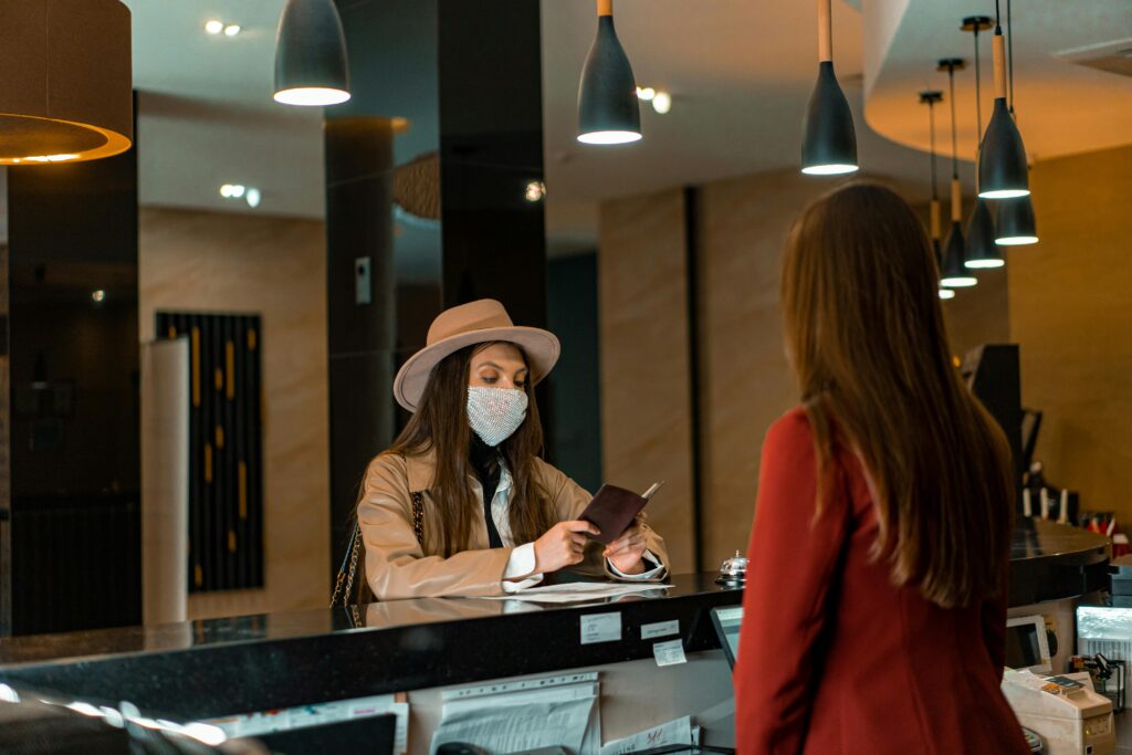 Woman standing in a hotel, representing seasonal jobs in hotels and resorts without experience