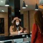 Woman standing in a hotel, representing seasonal jobs in hotels and resorts without experience