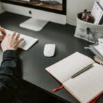 Person working on a laptop while searching for job opportunities in Germany from abroad